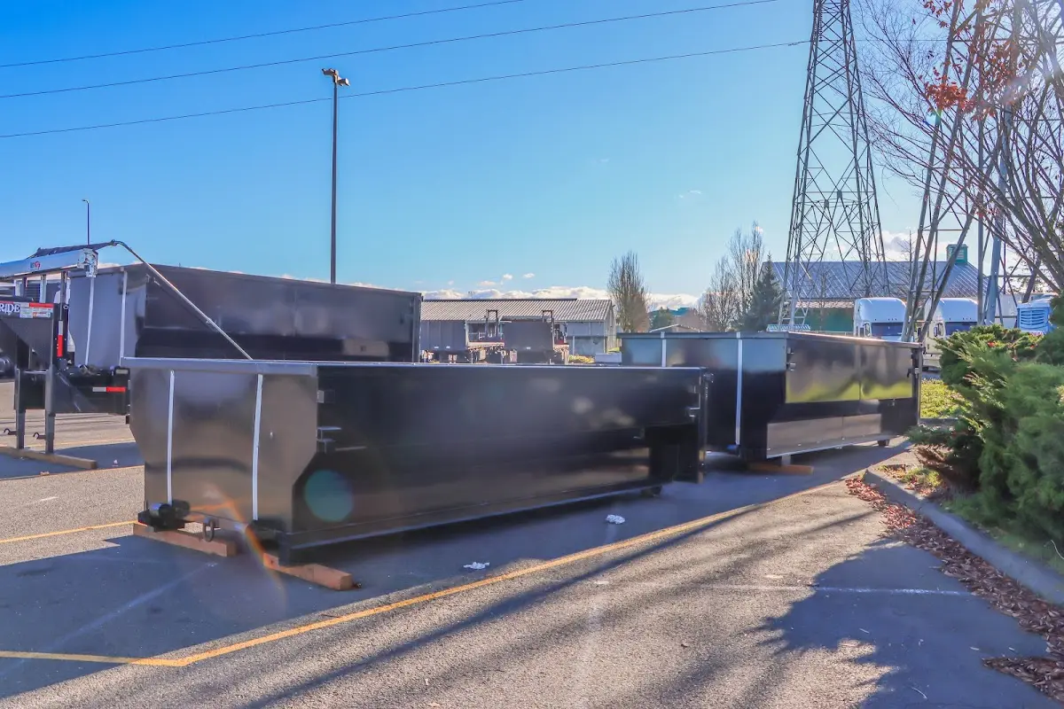 Roll-off dumpster ready for waste disposal at job site for Yard Waste Dumpster Rental in Bear Creek